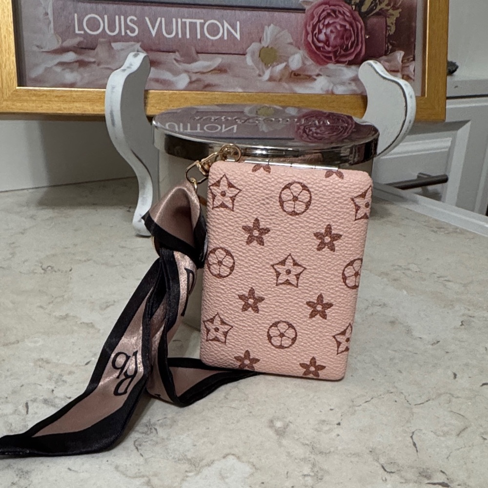 Vegan leather compact mirror keychain and bag charm in popular design.